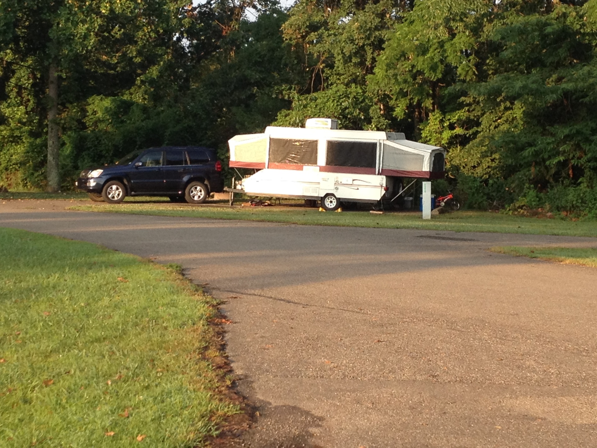 The Binker Lee popup camper set up at a campsite, towed there by the family 2007 Lexus GX470