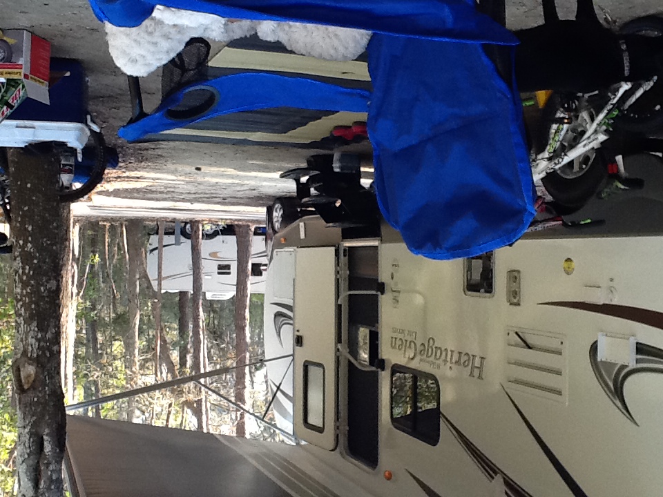 Heritage Glen campsite under the awning with bicycles parked beside the travel trailer