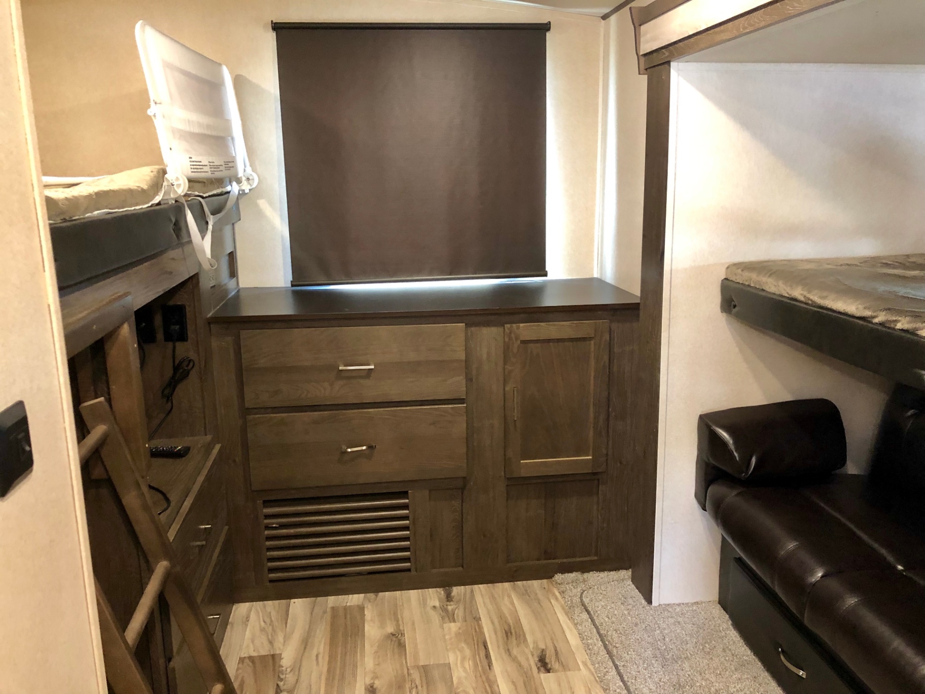2018 Heritage Glen LTZ 312QBUD bunk room with dresser storage, bunk beds, and ladder