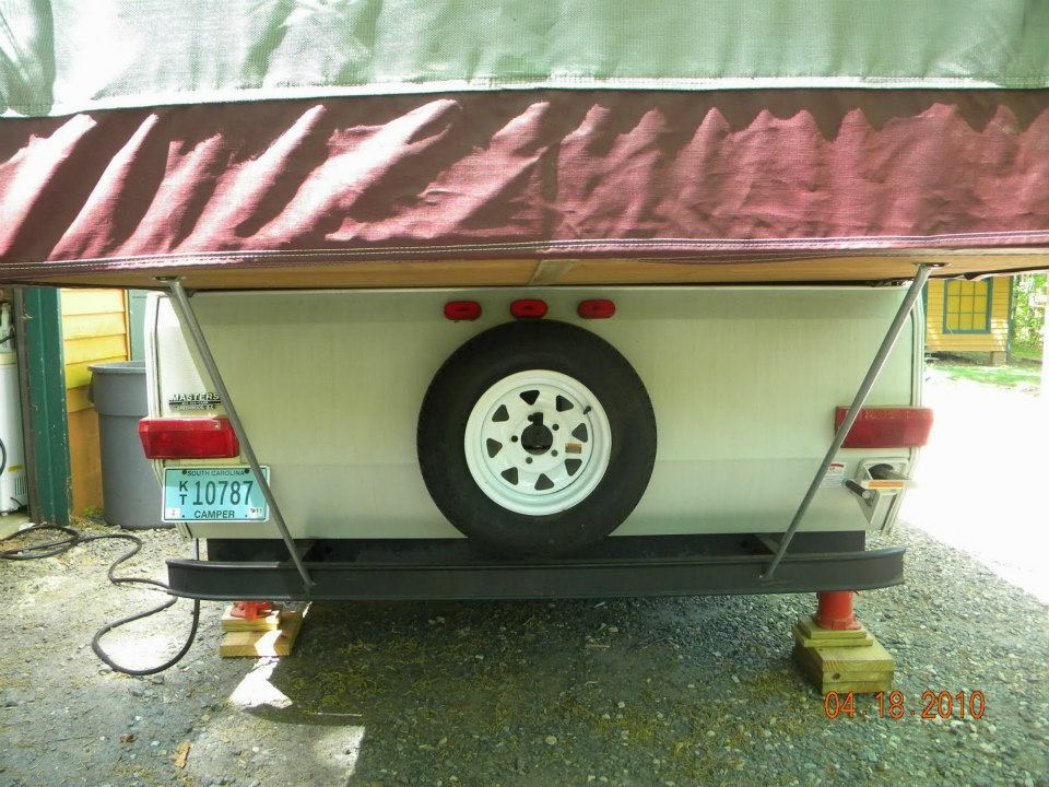 Rear view of the Jayco Eagle popup camper showing the spare tire mounted on the bumper