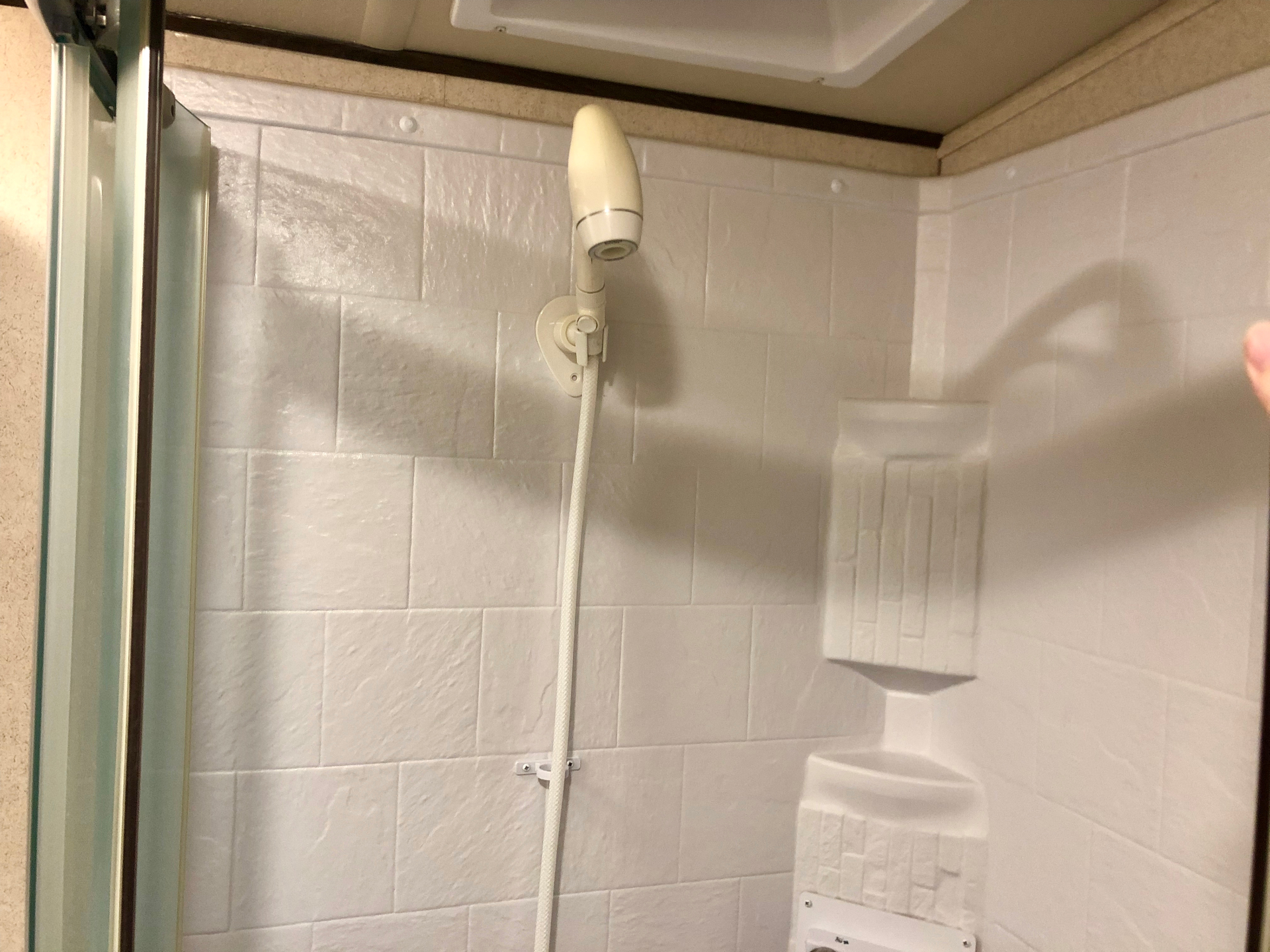 Glass-door shower stall inside the 2018 Heritage Glen LTZ 312QBUD bathroom