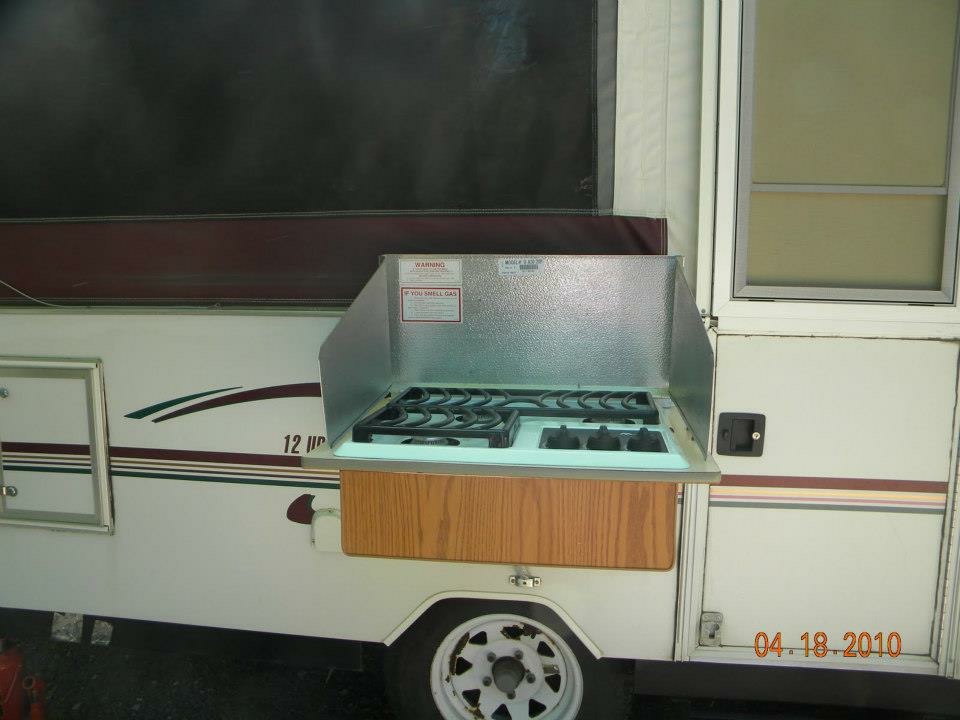 Slide-out exterior stove and propane cooktop deployed from the side of the Jayco Eagle popup